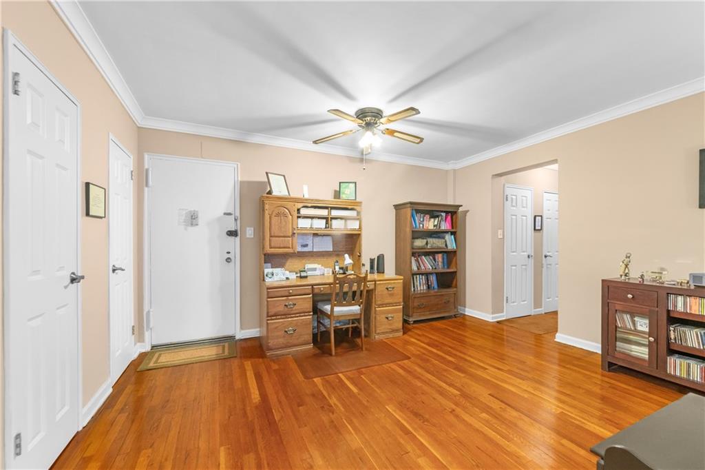 9201 Shore Road, Unit C508 Brooklyn, NY 11209 - Photo 10 of 15 a big room with chandelier fan and wooden floors