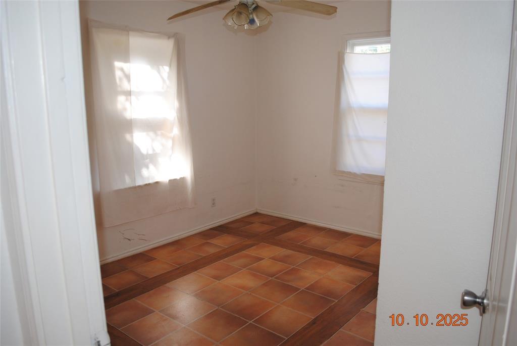 1660 Marsalis Road Lancaster, TX 75146 - Photo 4 of 12 a view of an empty room and window