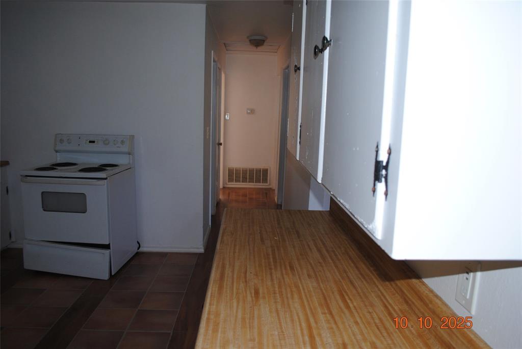1660 Marsalis Road Lancaster, TX 75146 - Photo 6 of 12 a view of a hallway with wooden floor