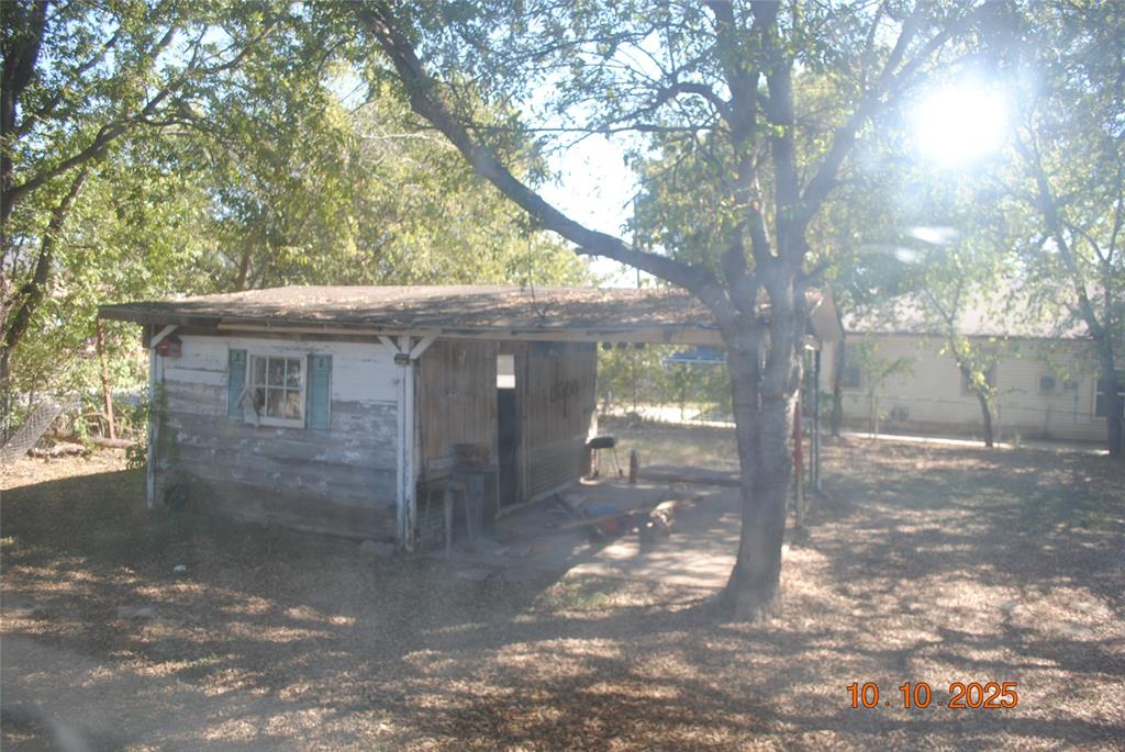 1660 Marsalis Road Lancaster, TX 75146 - Photo 10 of 12 a view of a house with a tree