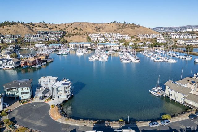 an aerial view of a house with a lake view
