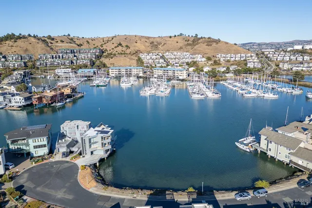 an aerial view of a house with a lake view