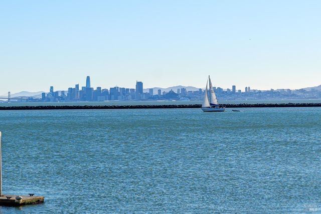 a view of a house with a yard and a car parked