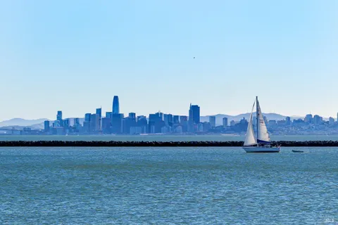 a view of a house with a yard and a large window