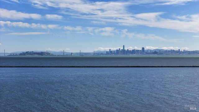 a view of an ocean beach and city
