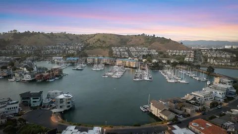 a view of a lake in middle of a town