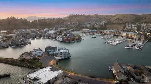 an aerial view of a house with a lake view