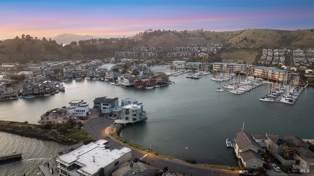 an aerial view of a house with a lake view