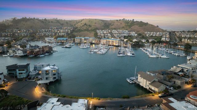 an aerial view of a house with a lake view