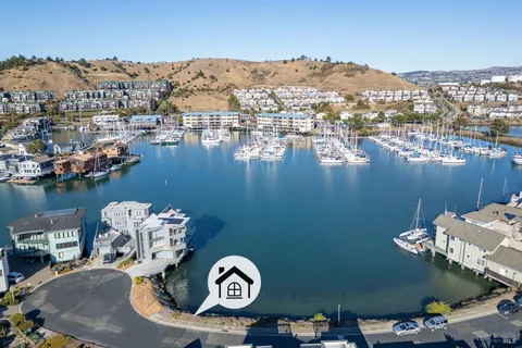 an aerial view of a house with a lake view