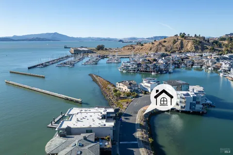 an aerial view of a house with a table and chairs