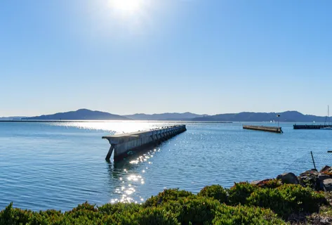 a view of a backyard with table and chairs