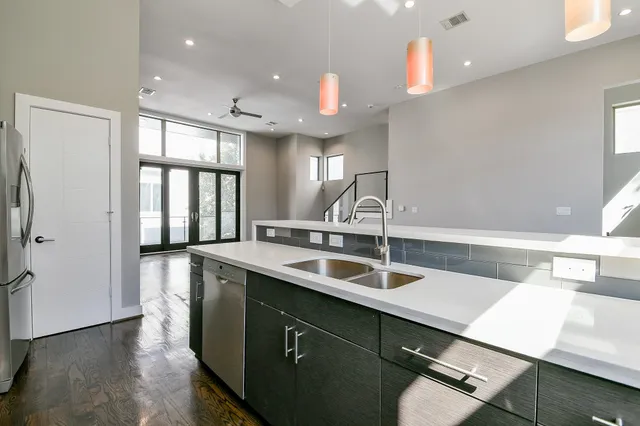 a kitchen with a sink and a refrigerator