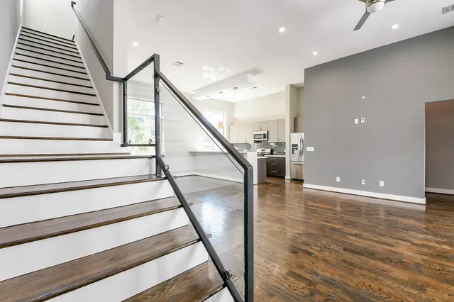 a view of entryway and hall with wooden floor