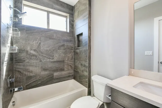 a bathroom with a sink toilet and bathtub