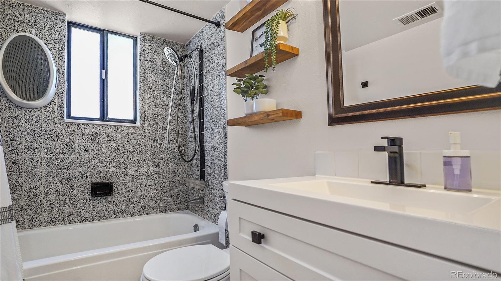 195 Brookside Drive Bailey, CO 80421 - Photo 11 of 24 a bathroom with a sink a bathtub and a shower