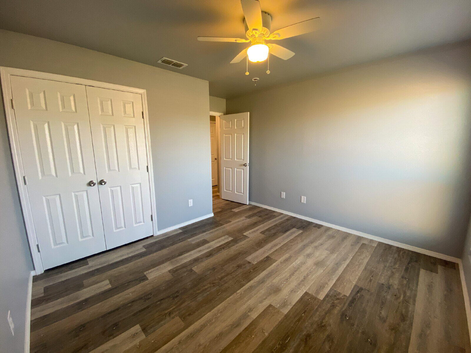 8526 11th Street Lubbock, TX 79416 - Photo 13 of 13 wooden floor in an empty room