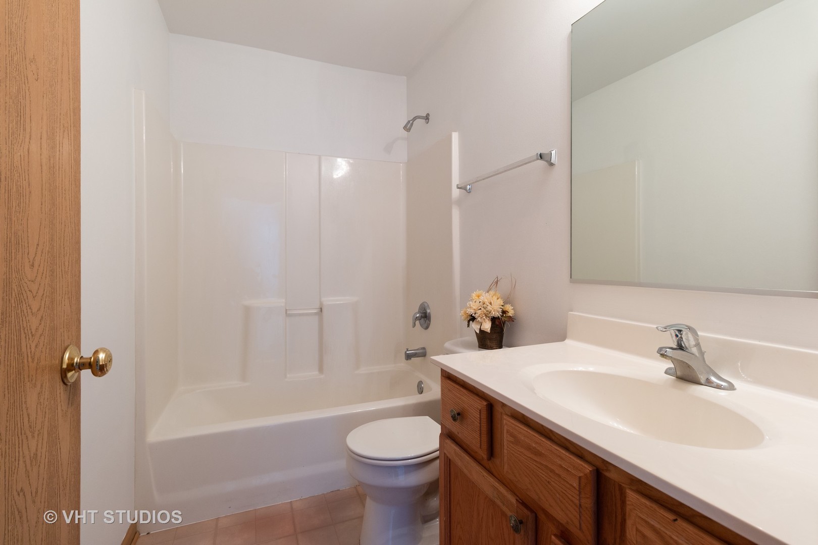 545 Maggie Lane Romeoville, IL 60446 - Photo 17 of 23 a bathroom with a sink a toilet and a bathtub