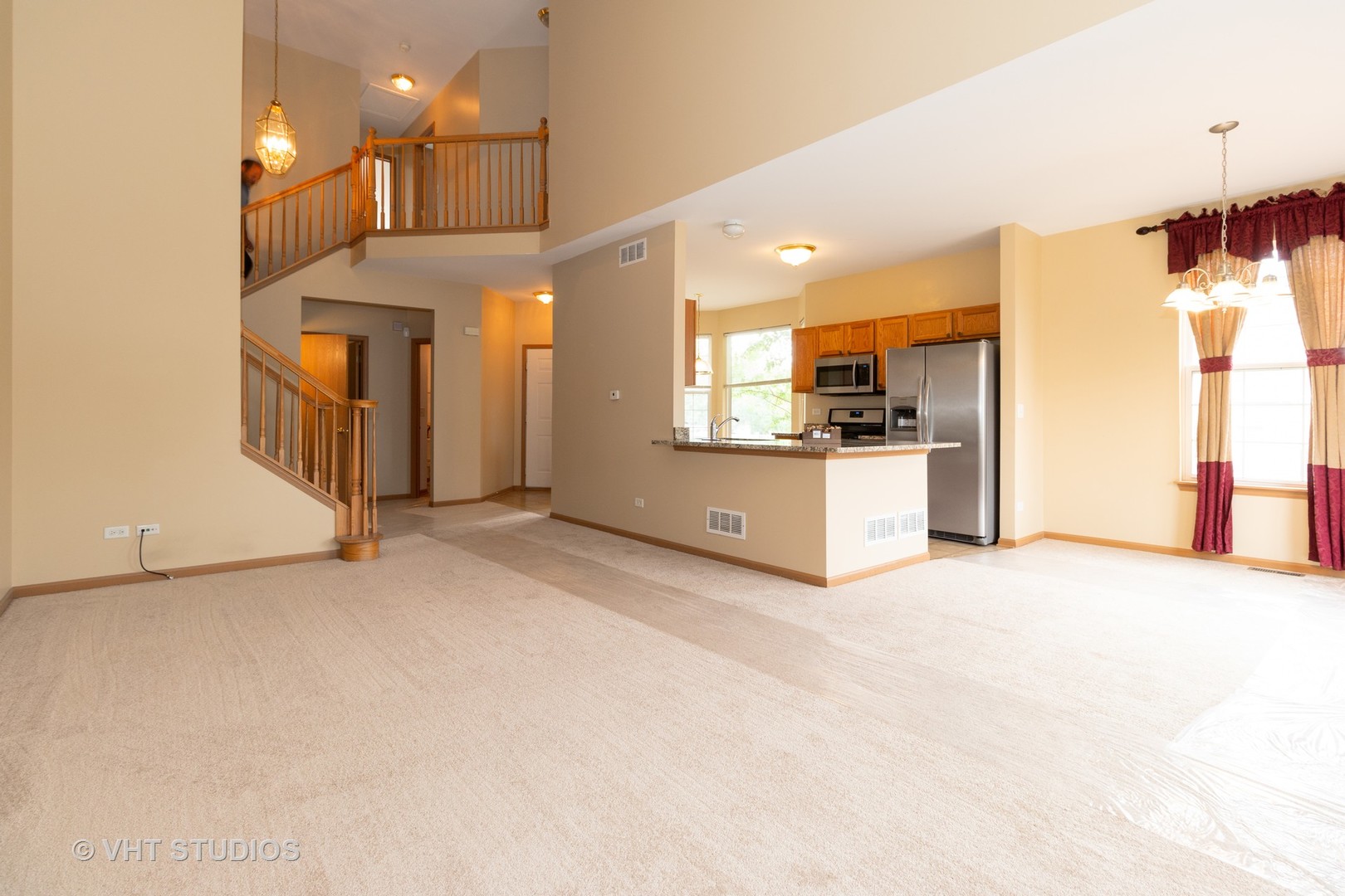 545 Maggie Lane Romeoville, IL 60446 - Photo 3 of 23 a view of a kitchen with a sink and a refrigerator