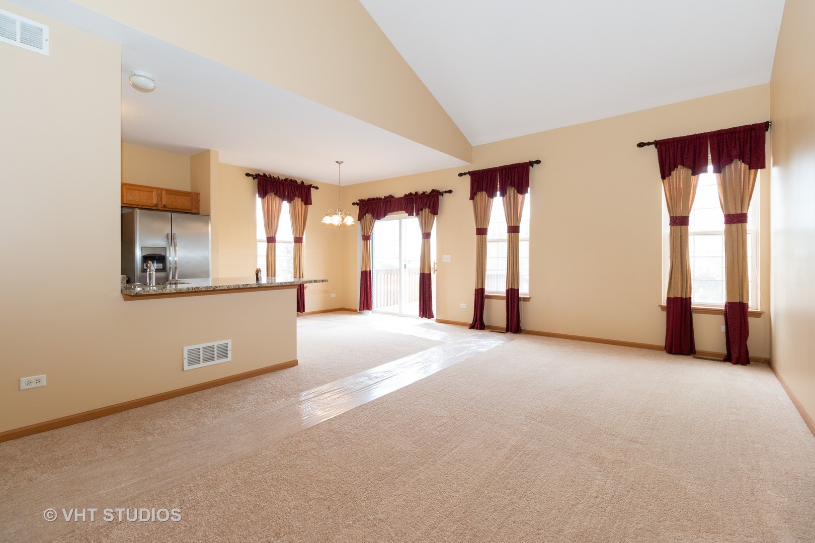 545 Maggie Lane Romeoville, IL 60446 - Photo 4 of 23 a view of a room with large windows