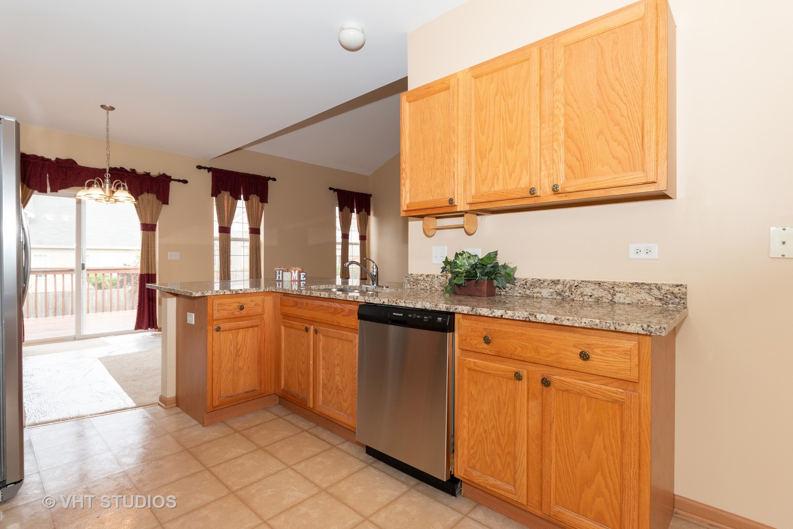 545 Maggie Lane Romeoville, IL 60446 - Photo 6 of 23 a view of a kitchen with granite countertop cabinets and a sink