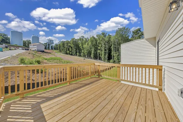 a view of a balcony with wooden floor