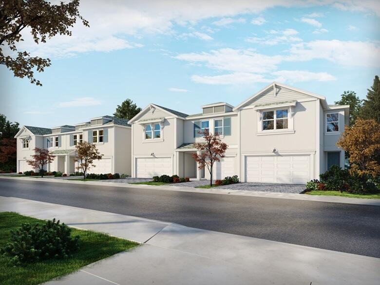 5788 Southeast Edgewater Circle Stuart, FL 34997 - Photo 1 of 9 a front view of a house with a garden