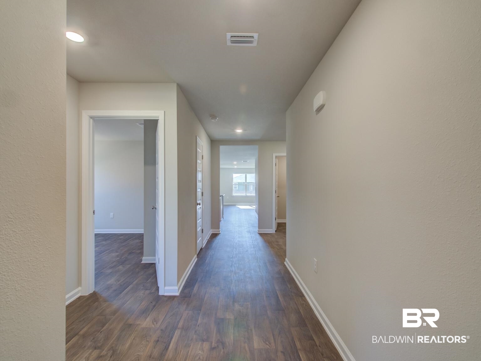 23953 Citation Loop Daphne, AL 36526 - Photo 5 of 49 Hallway with dark wood-style floors, recessed lighting, and a textured wall