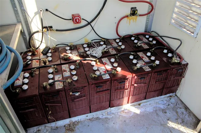 a large kitchen with stainless steel appliances granite countertop a large center island and a stove