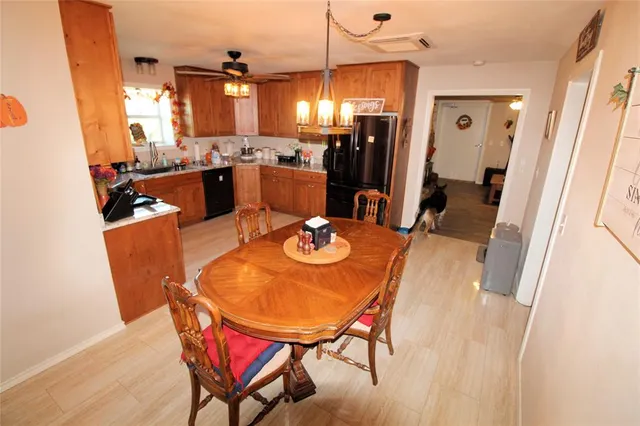 a room with furniture a window and a view of bedroom
