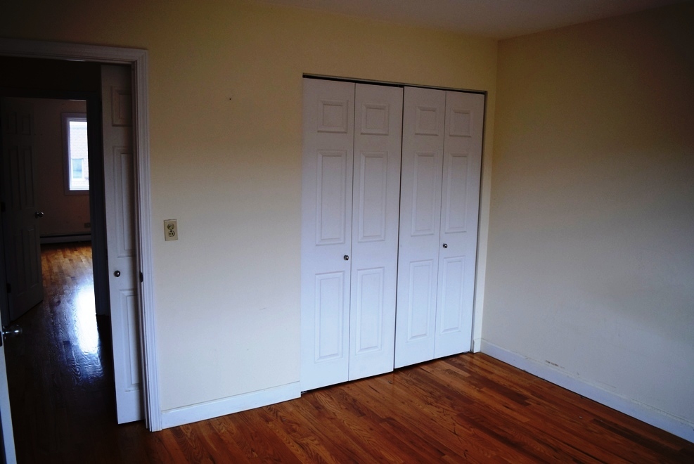 10473 Dearlove Road, Unit 6 Glenview, IL 60025 - Photo 12 of 21 a view of an empty room with wooden floor