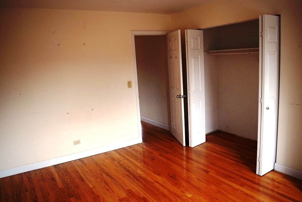 10473 Dearlove Road, Unit 6 Glenview, IL 60025 - Photo 15 of 21 an empty room with wooden floor and closet
