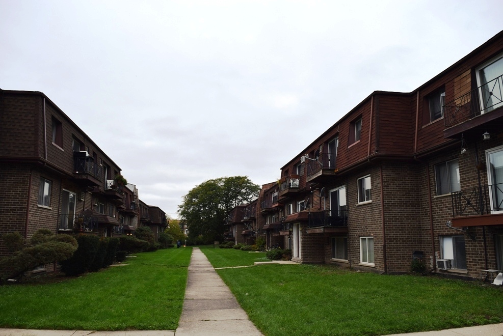 10473 Dearlove Road, Unit 6 Glenview, IL 60025 - Photo 2 of 21 a city view with tall buildings and a yard