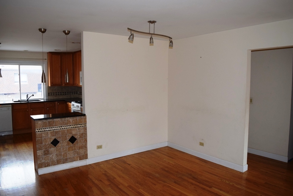 10473 Dearlove Road, Unit 6 Glenview, IL 60025 - Photo 6 of 21 a view of a kitchen with a sink and a refrigerator