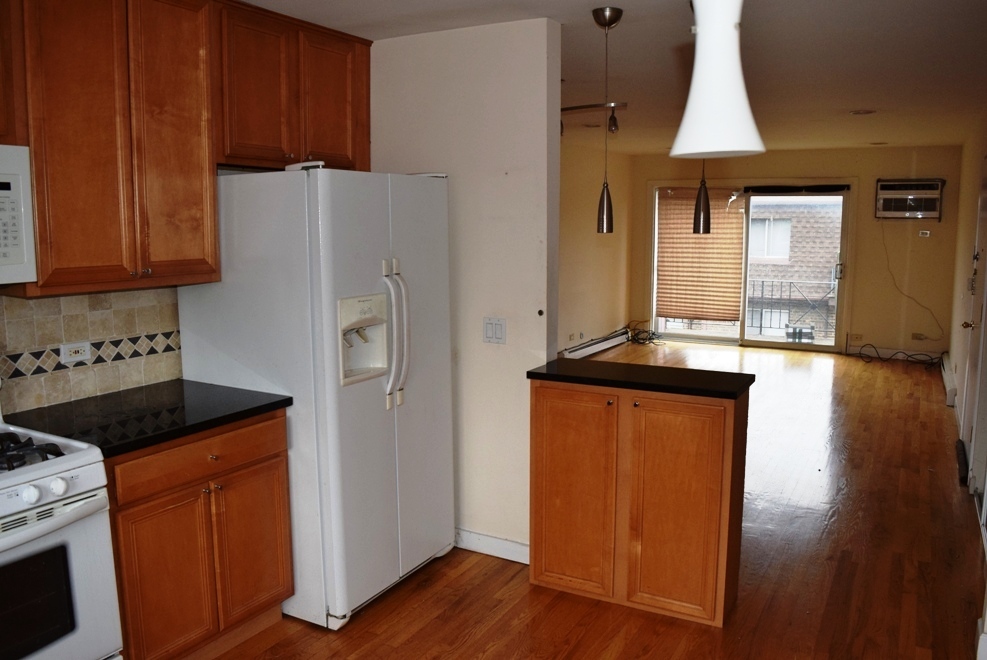 10473 Dearlove Road, Unit 6 Glenview, IL 60025 - Photo 8 of 21 a kitchen with granite countertop a refrigerator a stove a sink and dishwasher with wooden floor