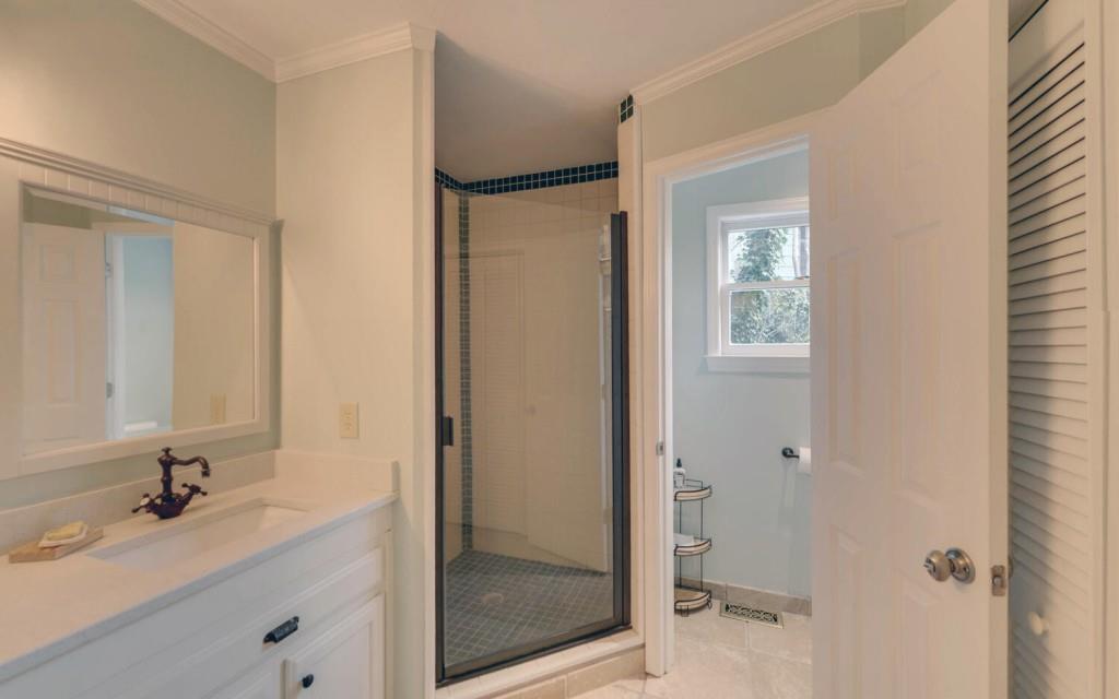 1431 Tame Turkey Road Lakemont, GA 30552 - Photo 16 of 62 a bathroom with a tub sink vanity and a mirror