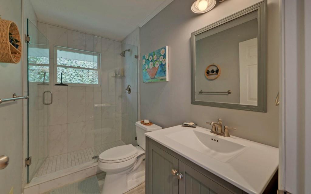 1431 Tame Turkey Road Lakemont, GA 30552 - Photo 20 of 62 a bathroom with a sink toilet and shower