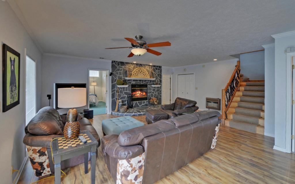 1431 Tame Turkey Road Lakemont, GA 30552 - Photo 25 of 62 a living room with furniture and wooden floor