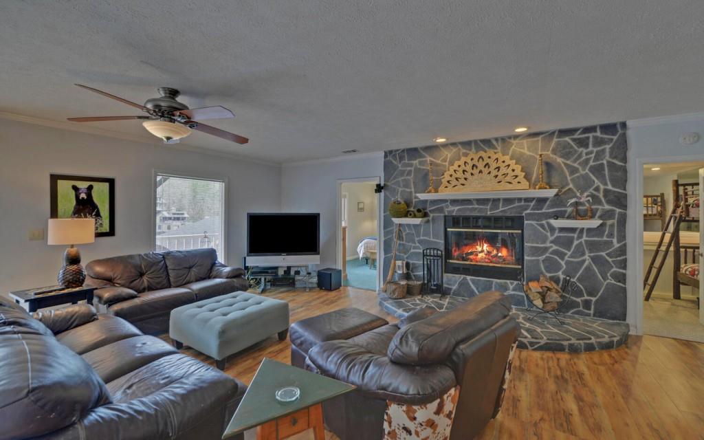 1431 Tame Turkey Road Lakemont, GA 30552 - Photo 26 of 62 a living room with furniture and a fireplace