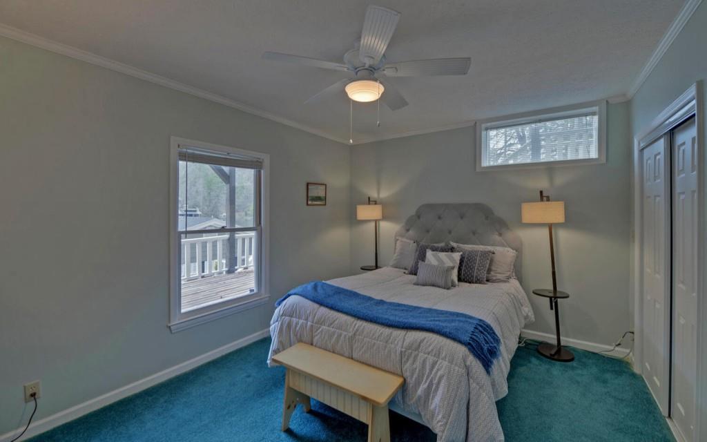 1431 Tame Turkey Road Lakemont, GA 30552 - Photo 34 of 62 a bedroom with a bed and a window