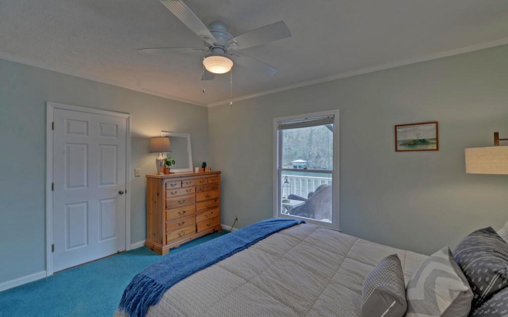 1431 Tame Turkey Road Lakemont, GA 30552 - Photo 35 of 62 a bedroom with a bed and a dresser