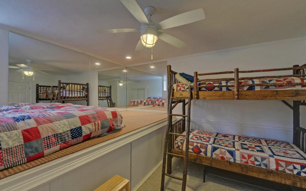 1431 Tame Turkey Road Lakemont, GA 30552 - Photo 36 of 62 a bedroom with a bed and a chandelier