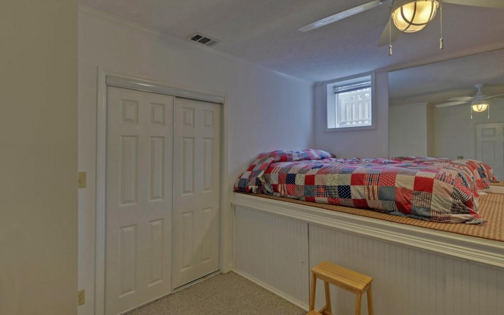 1431 Tame Turkey Road Lakemont, GA 30552 - Photo 37 of 62 a bedroom with a bed and painting on the wall