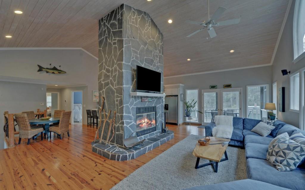 1431 Tame Turkey Road Lakemont, GA 30552 - Photo 4 of 62 a living room with furniture a fireplace and a flat screen tv