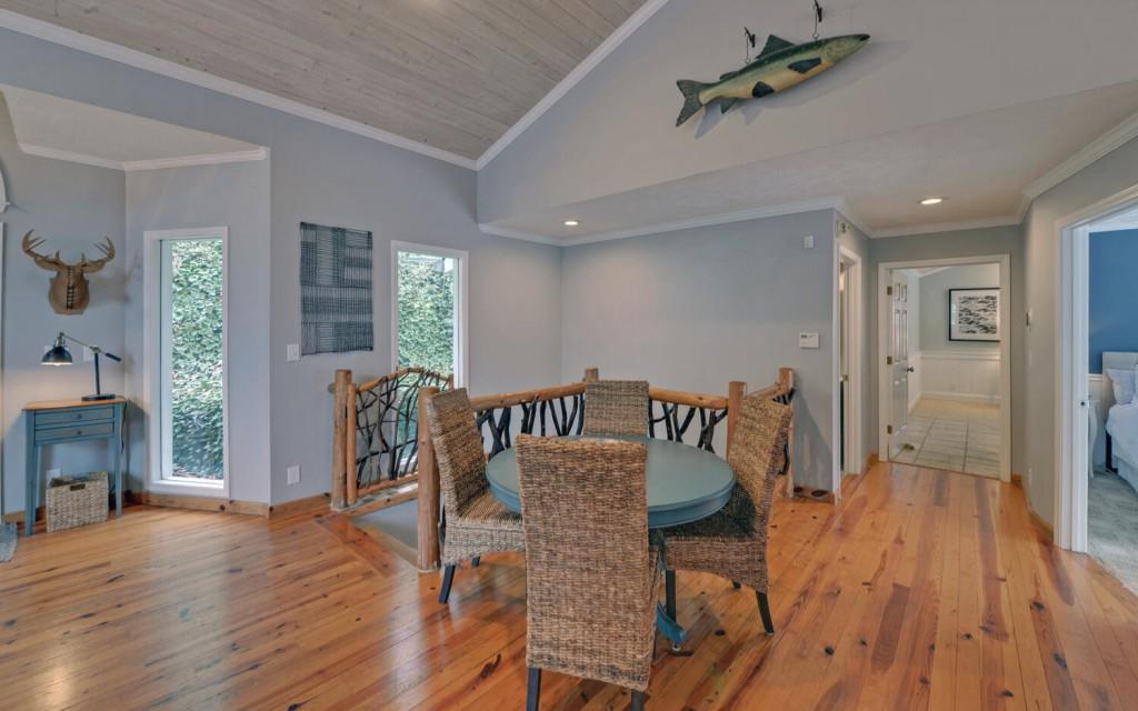 1431 Tame Turkey Road Lakemont, GA 30552 - Photo 7 of 62 a view of a dining room with furniture and wooden floor