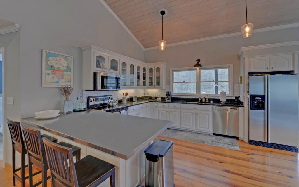 1431 Tame Turkey Road Lakemont, GA 30552 - Photo 9 of 62 a view of kitchen with sink and wooden floor