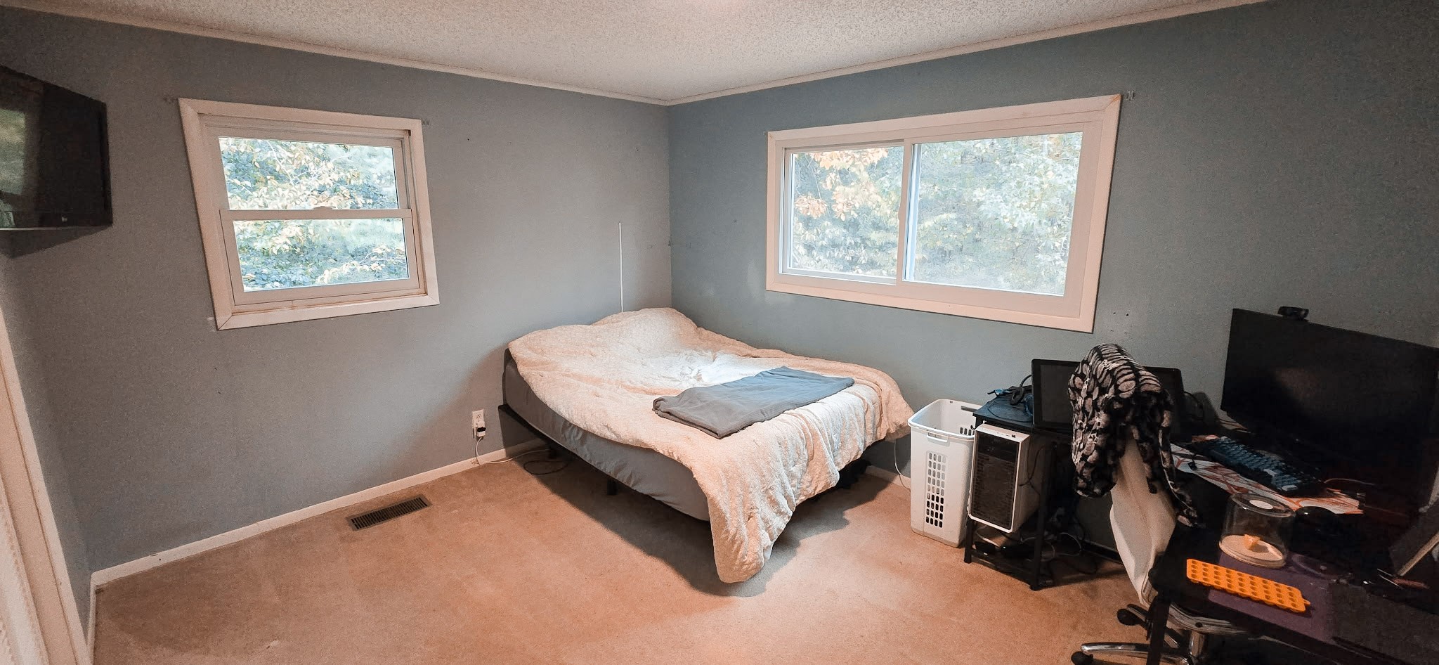 936 Ridge Road Quebeck, TN 38579 - Photo 24 of 32 a bedroom with a bed and a flat tv screen on a dresser