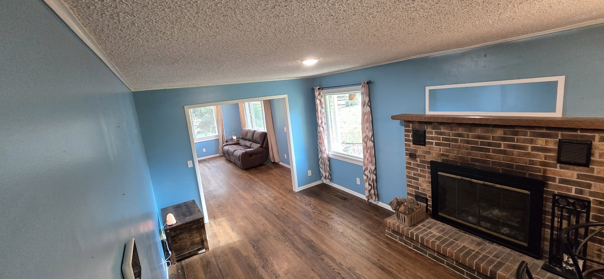 936 Ridge Road Quebeck, TN 38579 - Photo 9 of 32 a hallway with wooden floor a fireplace and entryway