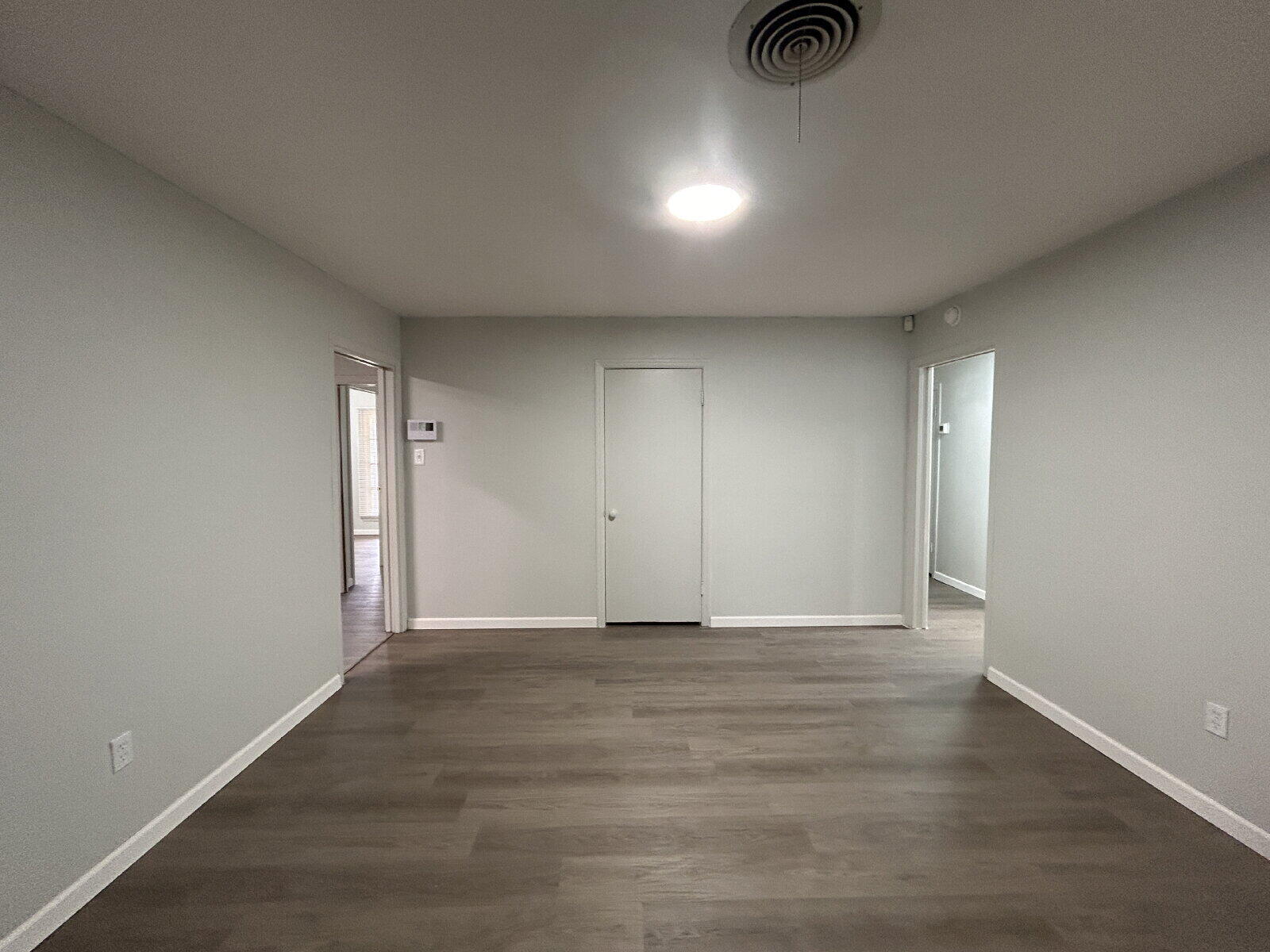 2815 33rd Street Lubbock, TX 79410 - Photo 2 of 9 a view of an empty room and wooden floor