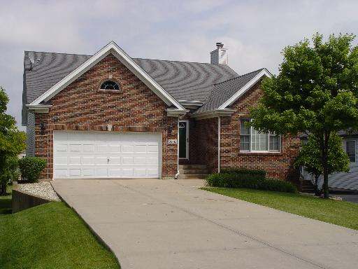 S715 Jefferson Street Winfield, IL 60190 - Photo 1 of 1 a front view of a house with a yard and garage
